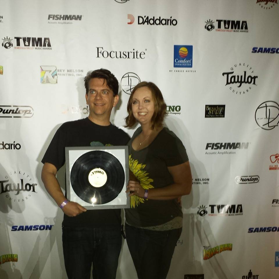 Keenwild holding a music award